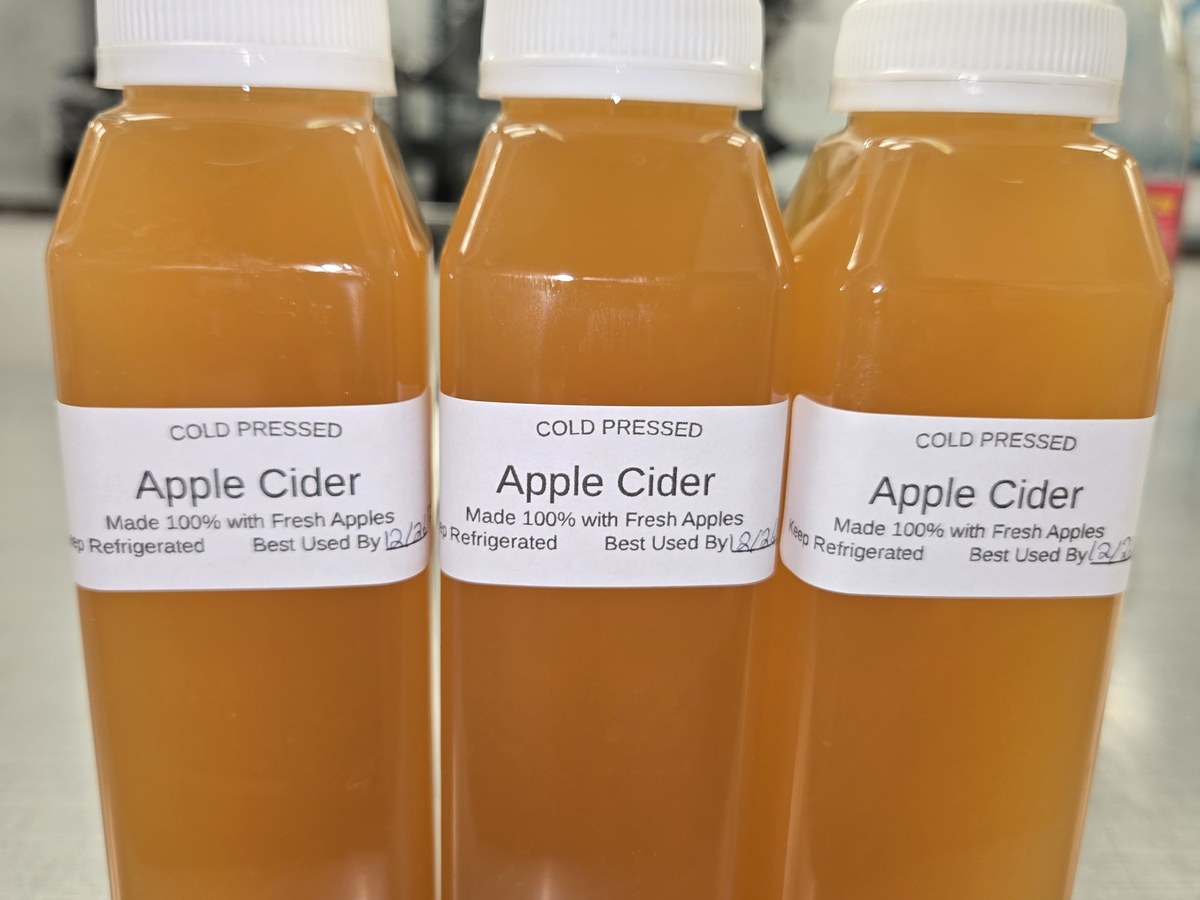 Cold-pressed apple cider in bottles